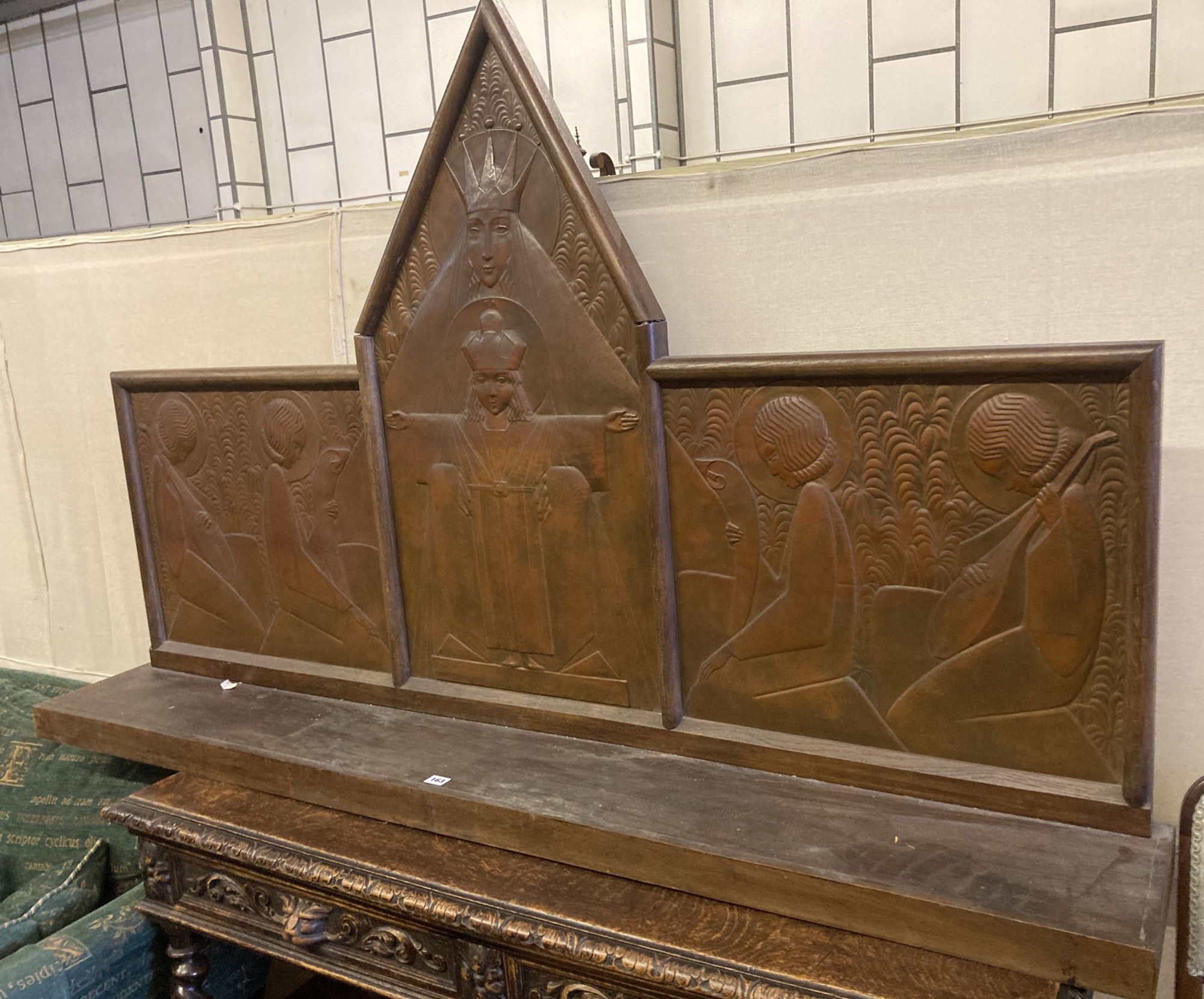 An Arts & Crafts oak and embossed copper triptych by Felix Jacques, signed and dated 1928, width 175cm, depth 26cm, height 112cm